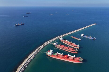 An aerial view shows container ships anchored off the coast of the Syrian port city of Tartus