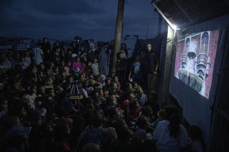 Palestinian man sets up cinema for children at Rafah camp, southern Gaza