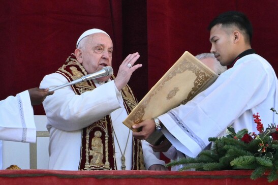 Pope Francis delivers the Urbi et Orbi message and blessing to the city and the world from the main