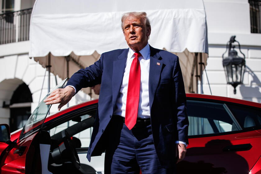 US President Trump views Tesla vehilces in front of the White House