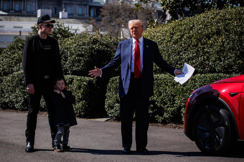 US President Trump views Tesla vehilces in front of the White House