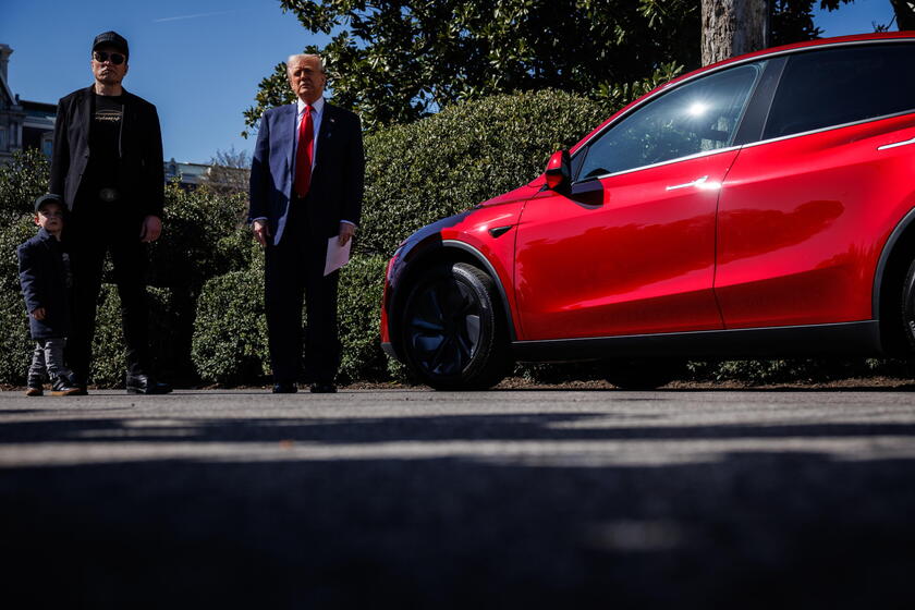 US President Trump views Tesla vehilces in front of the White House